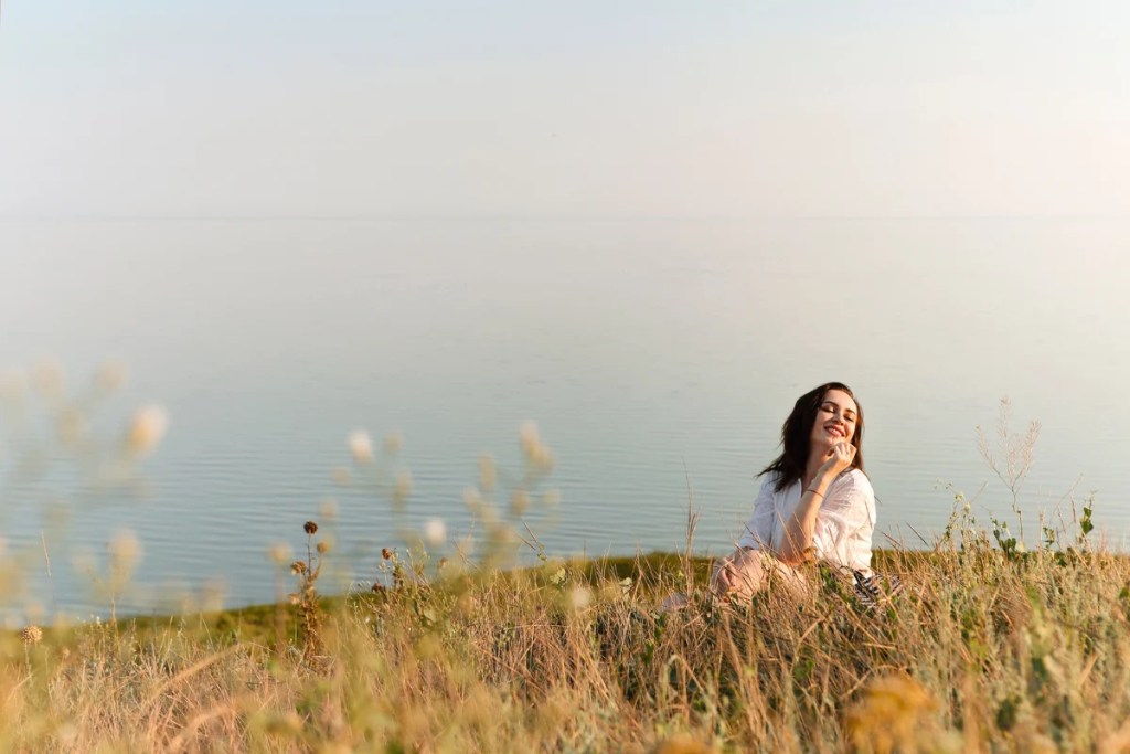 Woman in field of grass