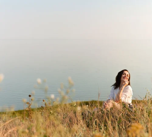 Woman in field of grass